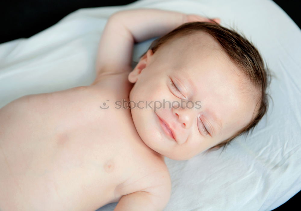 Similar – baby sleeping on his mother’s shoulder