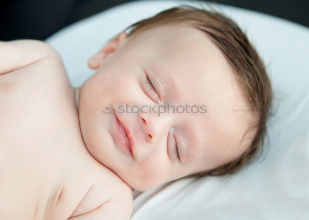 Similar – Baby sleeping on a blanket