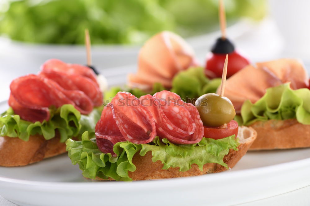 Similar – Homemade breakfast: bread with ham, onions, radish