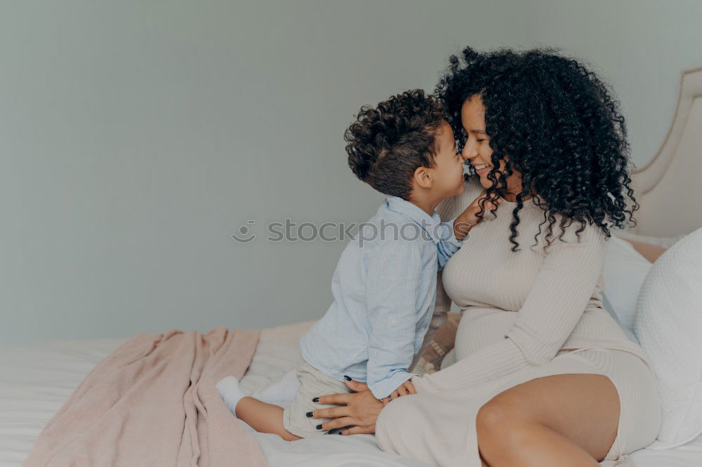 Similar – Happy mom and daughter using digital tablet together