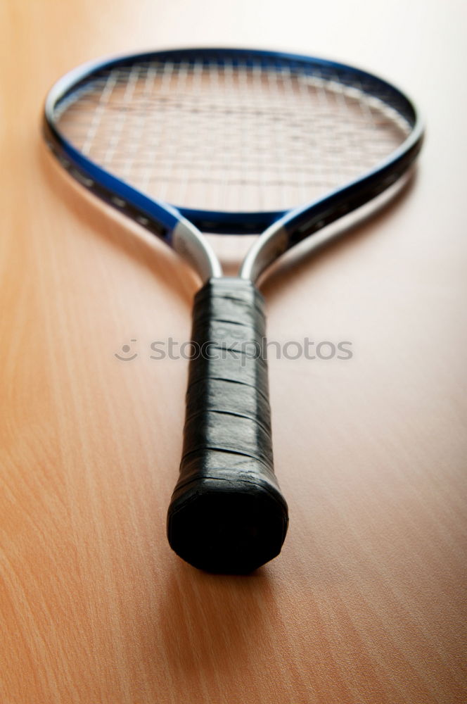 Similar – a badminton ball is lying on a badminton racket in the grass