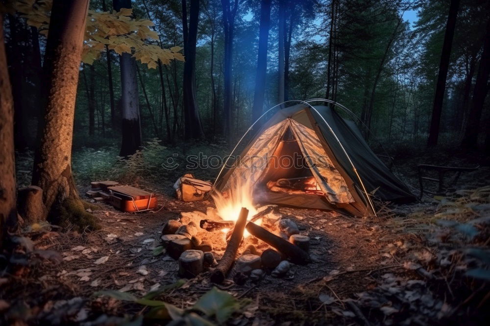 Similar – Man lights a fire in the fireplace in nature at night