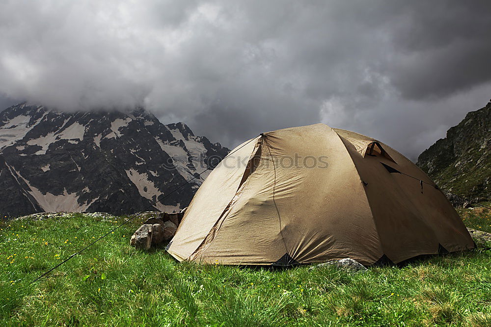 Similar – Tent in storm and rain in an autumn landscape