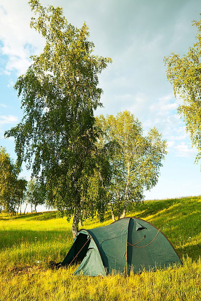 Similar – Tent in storm and rain in an autumn landscape