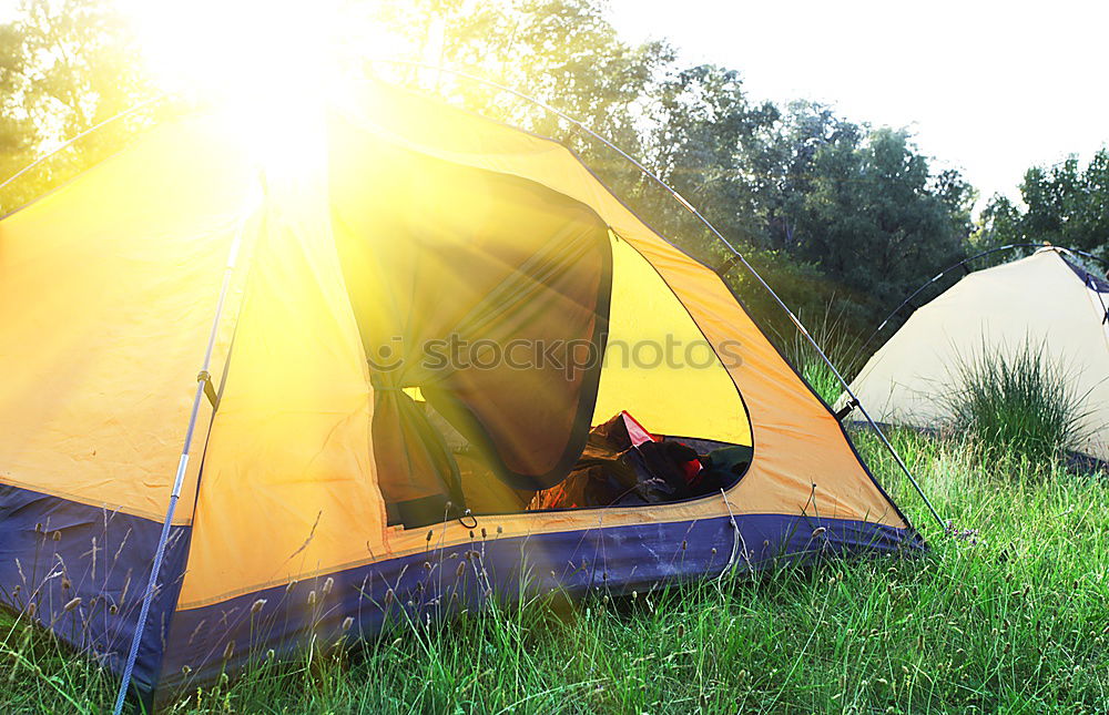 Similar – Orange tent in a pine forest