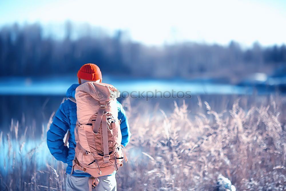 Similar – Woman walking outdoors on sunny snowy day in winter