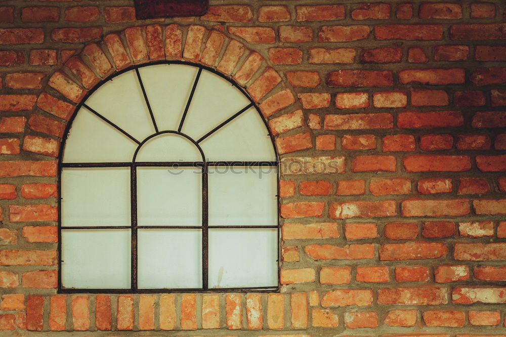 Similar – Two windows of a warehouse with red clinker and closed windows