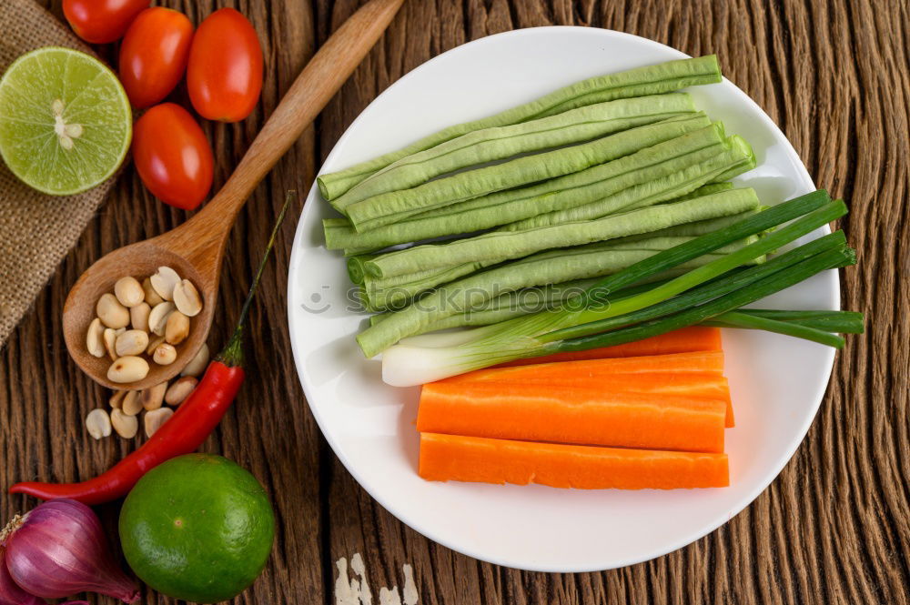 Similar – Vegetables and utensils on kitchen table