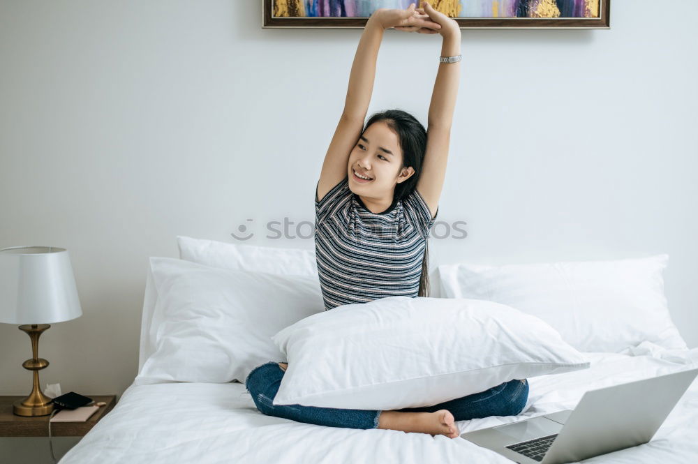 Similar – Woman stretching in bed