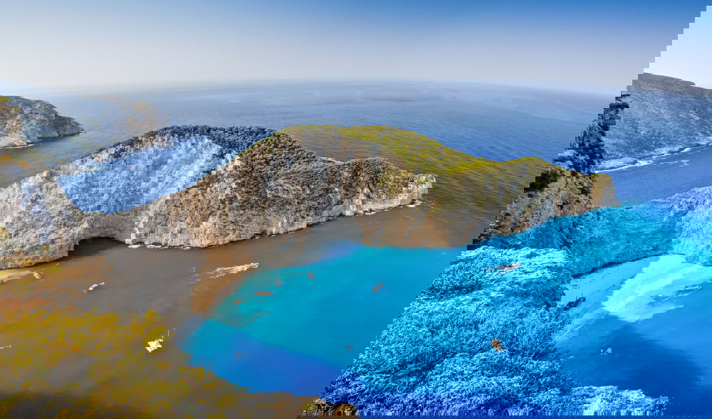 Similar – Image, Stock Photo Deserted sunny beach in a sea bay. Panoramic seascape from high position of a beautiful coastal place with deep blue sea water, sun light and wide blue sky.