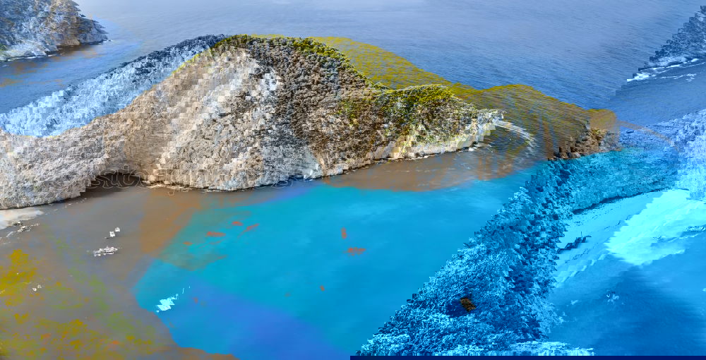 Similar – Image, Stock Photo Deserted sunny beach in a sea bay. Panoramic seascape from high position of a beautiful coastal place with deep blue sea water, sun light and wide blue sky.