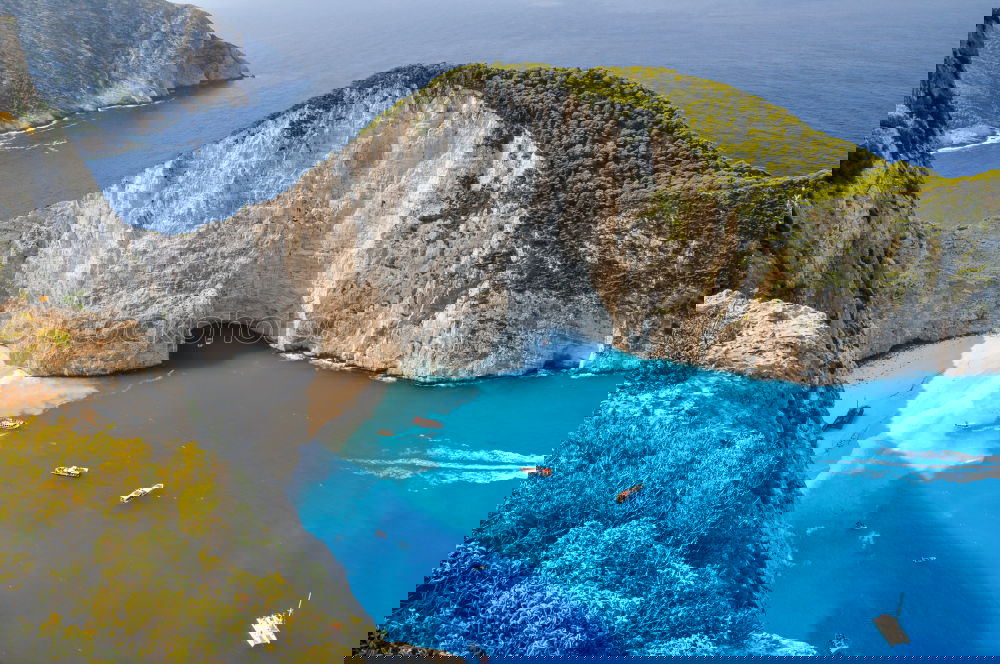 Similar – Image, Stock Photo Deserted sunny beach in a sea bay. Panoramic seascape from high position of a beautiful coastal place with deep blue sea water, sun light and wide blue sky.