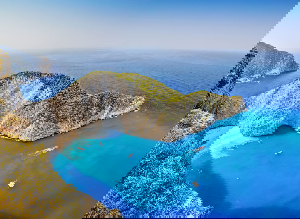 Similar – Image, Stock Photo Deserted sunny beach in a sea bay. Panoramic seascape from high position of a beautiful coastal place with deep blue sea water, sun light and wide blue sky.