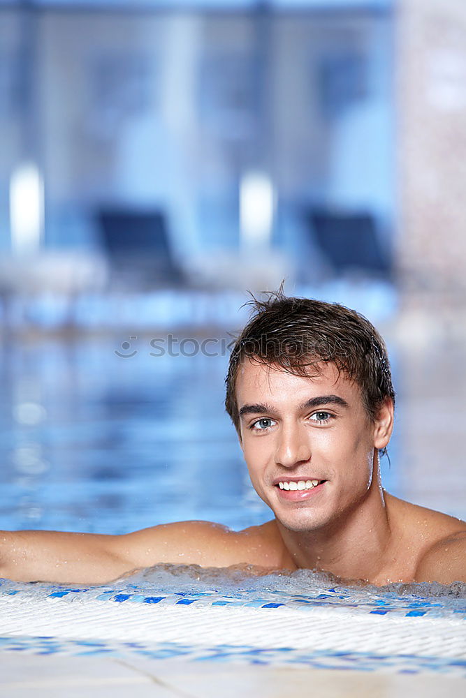 Similar – Young handsome man posing near a pool