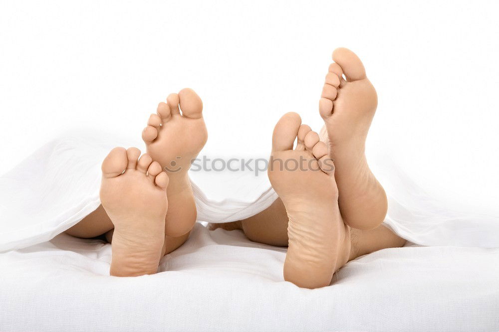 Similar – Image, Stock Photo close up feet of a couple under the white sheets blanket in bed,