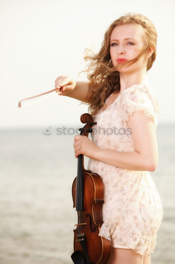 Similar – Image, Stock Photo Pretty woman with violin on field