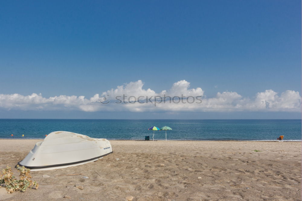 Similar – with parasol on the beach