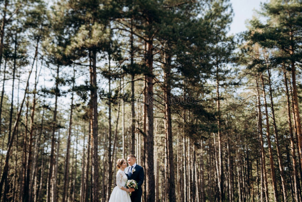 Similar – Elferly fit happy couple hiking through forest together on vacation