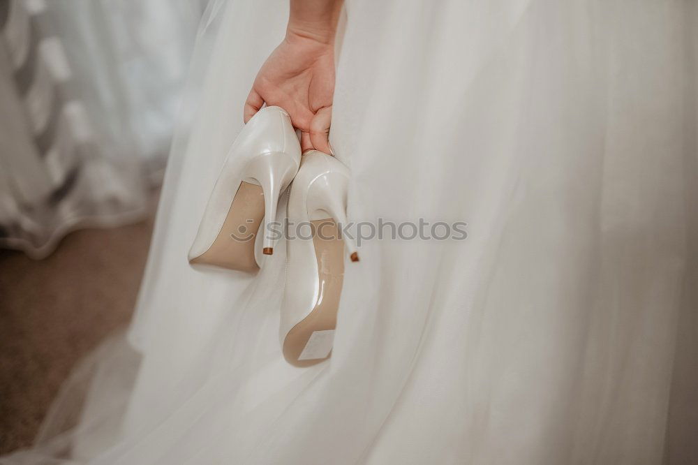 Image, Stock Photo Crop bride putting on shoes