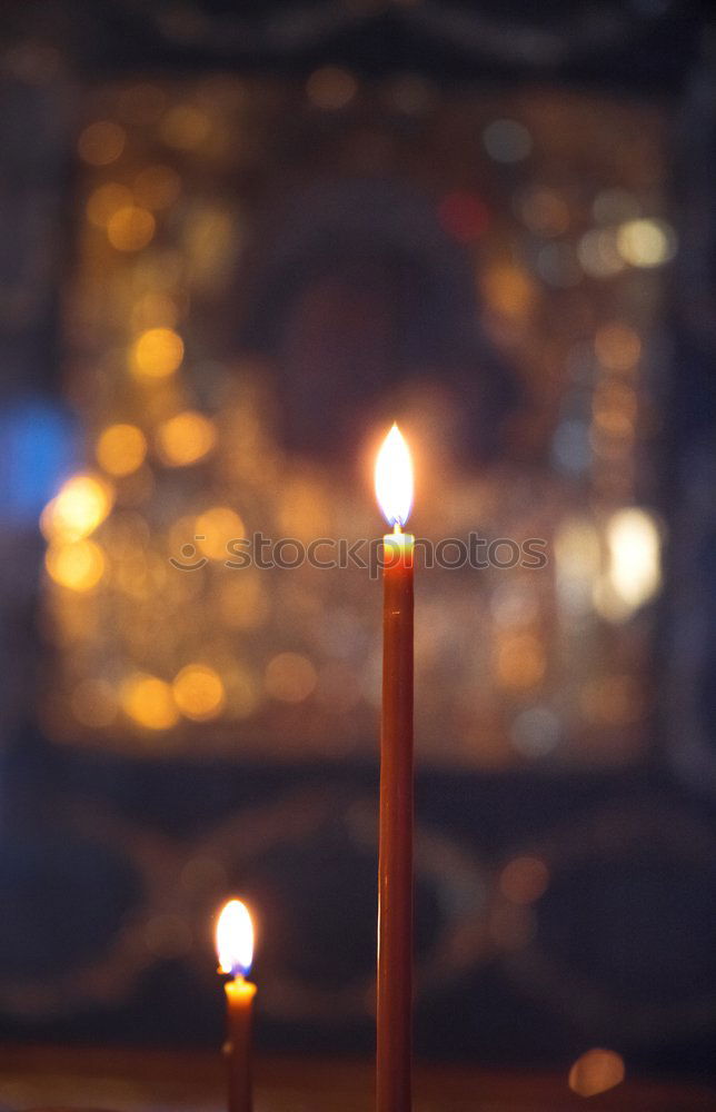 Similar – Lit beeswax candles in sand; Orthodox church