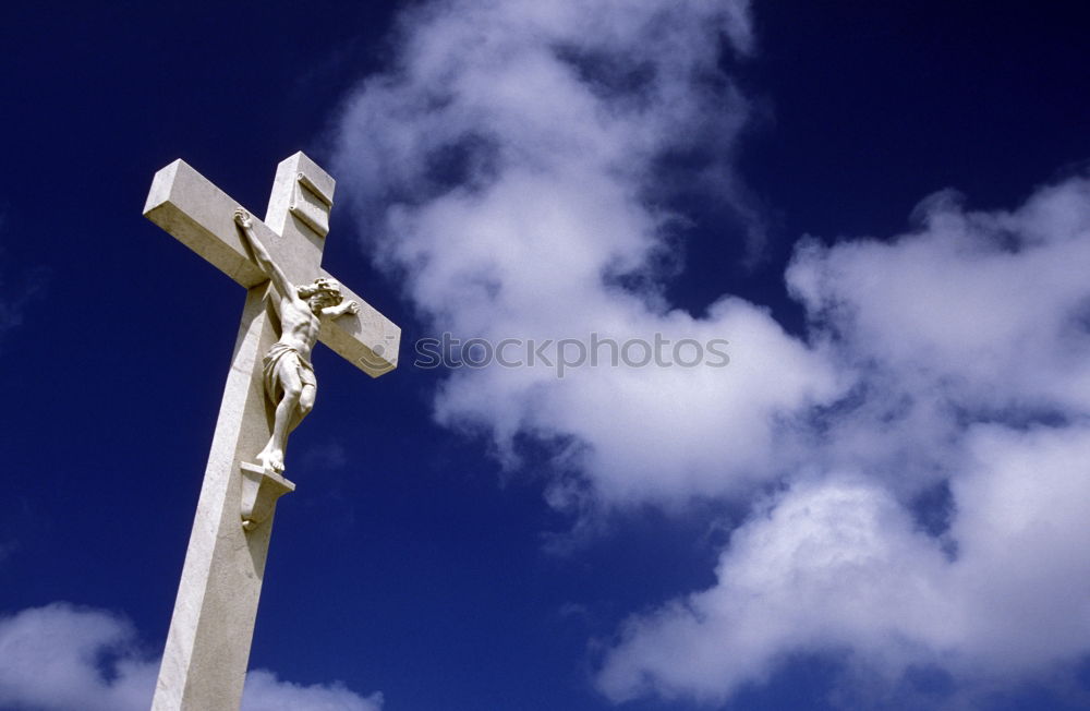 Similar – Embrace the Cross Statue