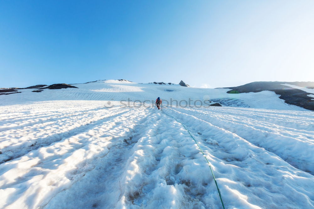 Similar – Two people in beautiful winter mountains