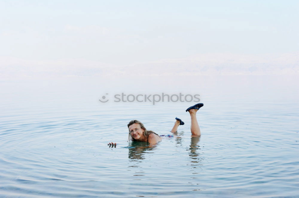 Similar – Foto Bild 500 | Schwimmzüge feminin