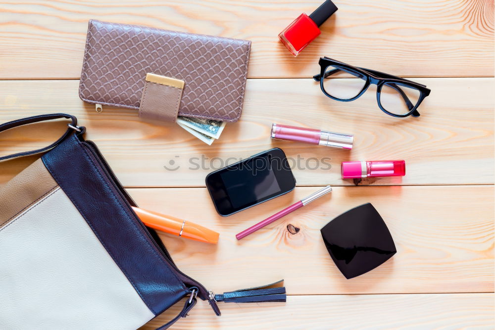 Similar – Image, Stock Photo Flat lay of woman bag open out with cosmetics