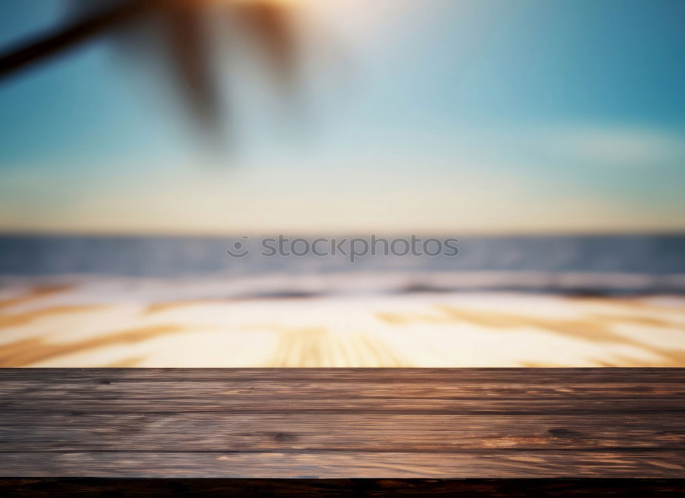 Similar – Umbrella on beach near sea