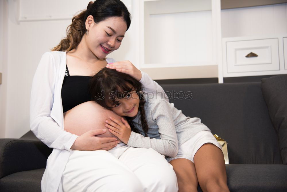 Similar – indoor portrait of happy mother comforting toddler son