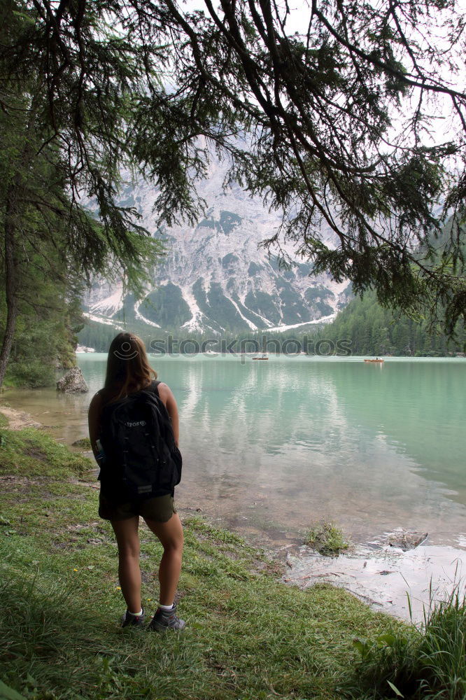 Similar – Women at lake in mountains