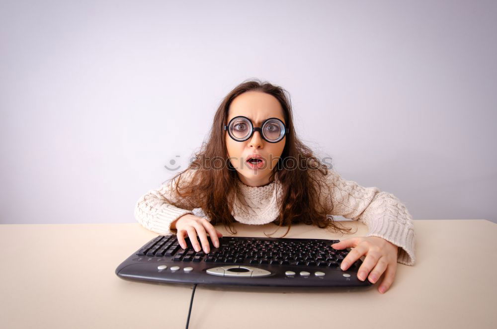 Similar – Image, Stock Photo Young desperate student with glasses looks over a laptop