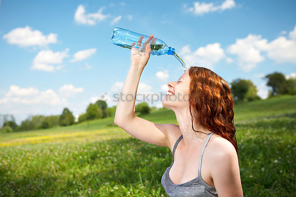 Similar – Fit sporty woman drinking water from a bottle