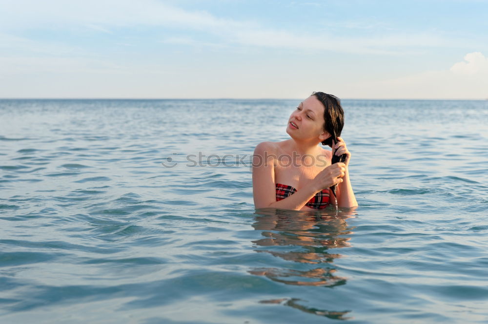 Similar – Foto Bild Reife Frau in guter Form beim Baden im Meer.