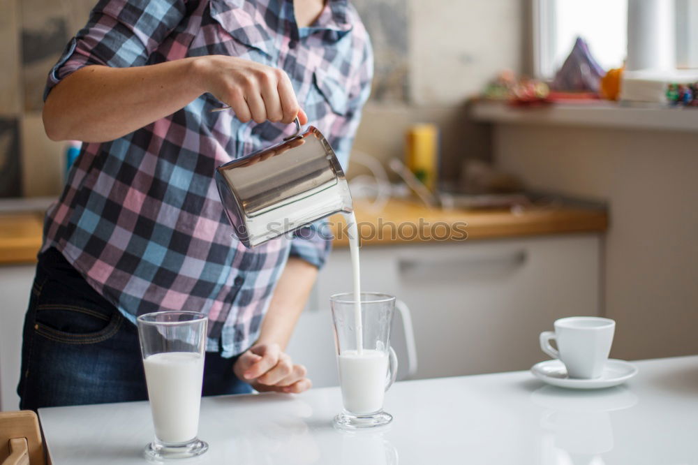 Similar – Hipster barista pours milk for making cappuccino or latte coffee in the cafe