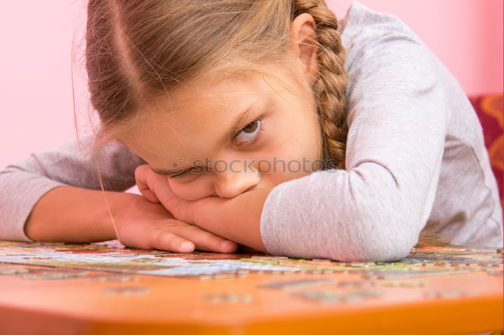 Similar – Girl decorating Christmas gingerbread cookies with chocolate