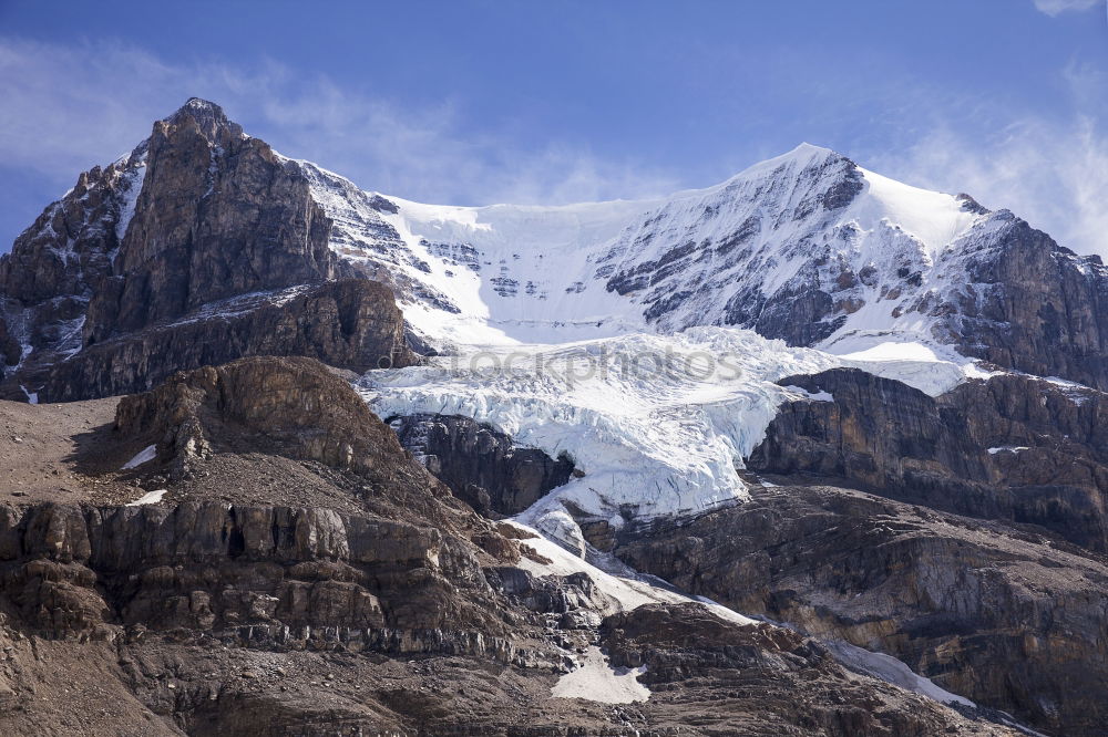 Similar – Man walking in snowy mountains