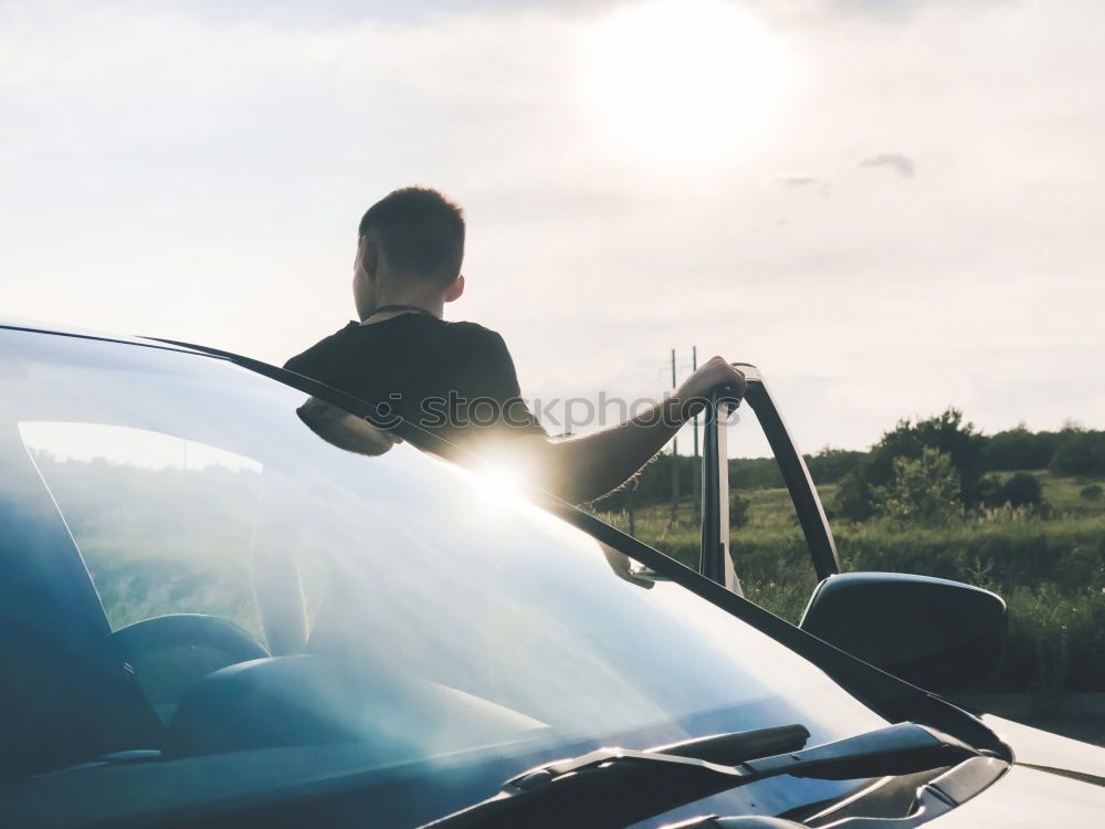 Similar – Man sleeping in vintage car