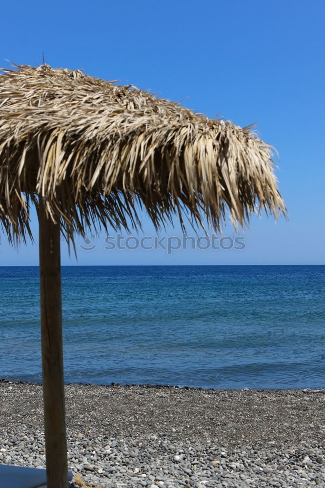 Similar – Straw umbrellas on the beach