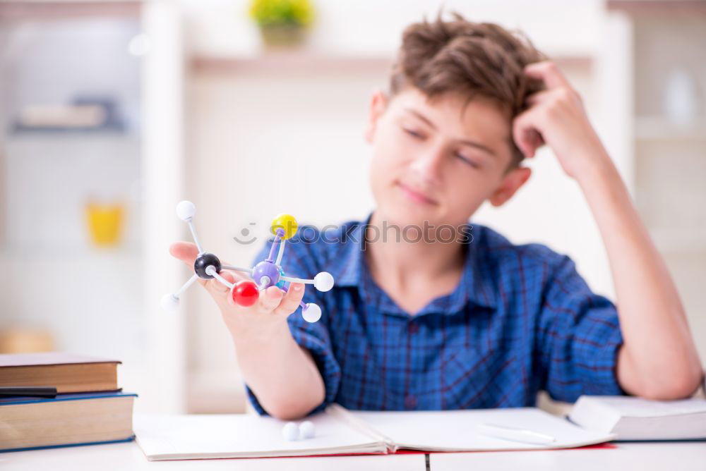 Similar – Young boy thinking about his homework