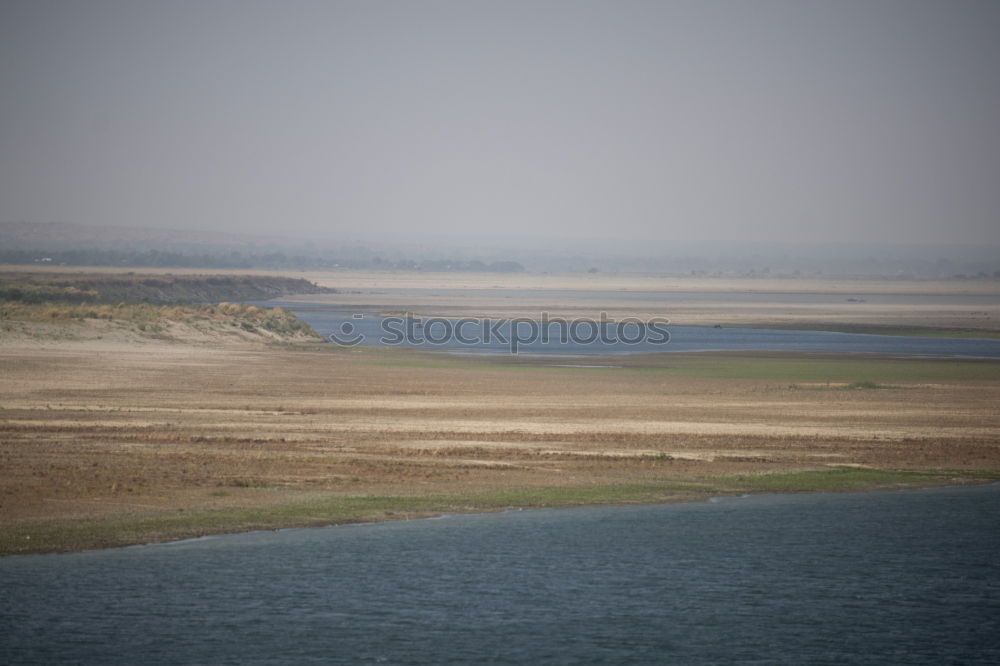 Similar – watt Mud flats Low tide