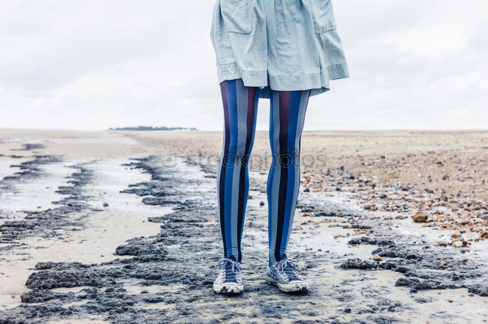 Similar – Kid standing on a porch wearing green wellies and raincoat