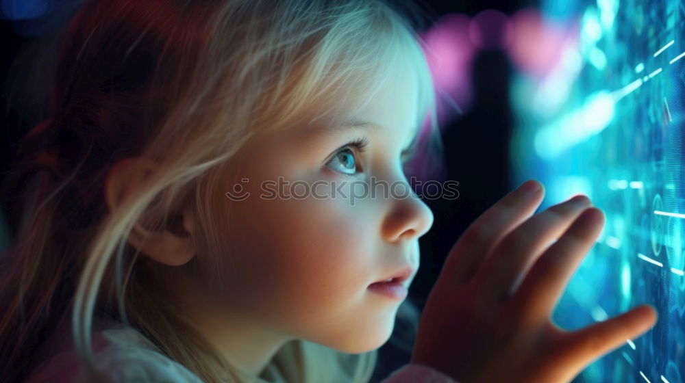 Sweet blondie girl playing on a Tablet.