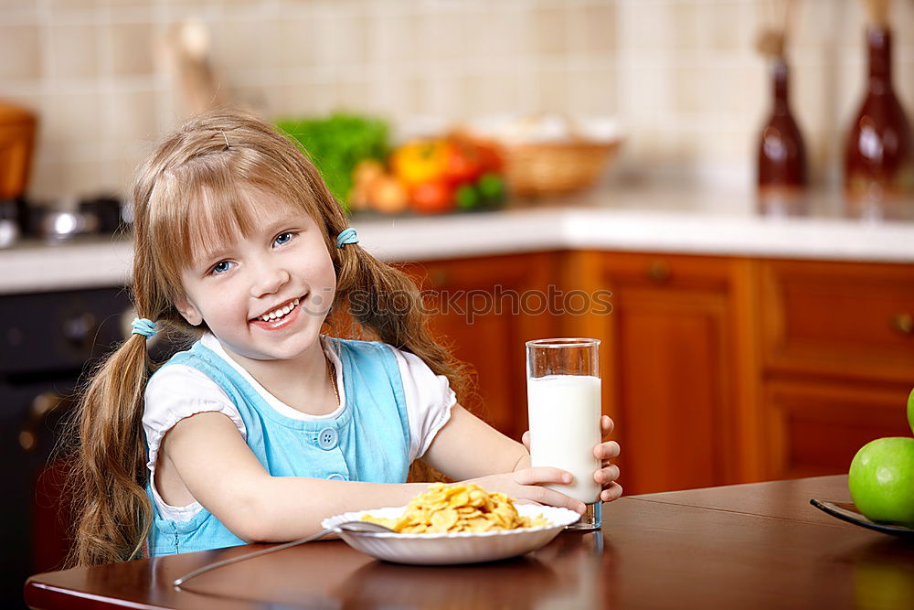Similar – Image, Stock Photo Portrait of little girl preparing baking cookies.
