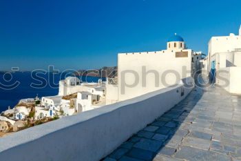 Similar – Image, Stock Photo Idyllic white houses on Santorini with windmills in front of blue sky