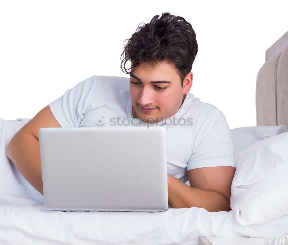 Similar – Young girl looking at mobile phone while sitting on bed