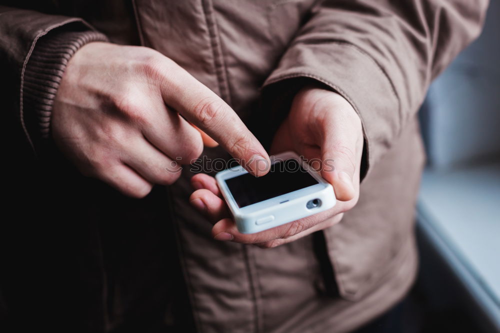 Similar – Tattooed man using a smartphone