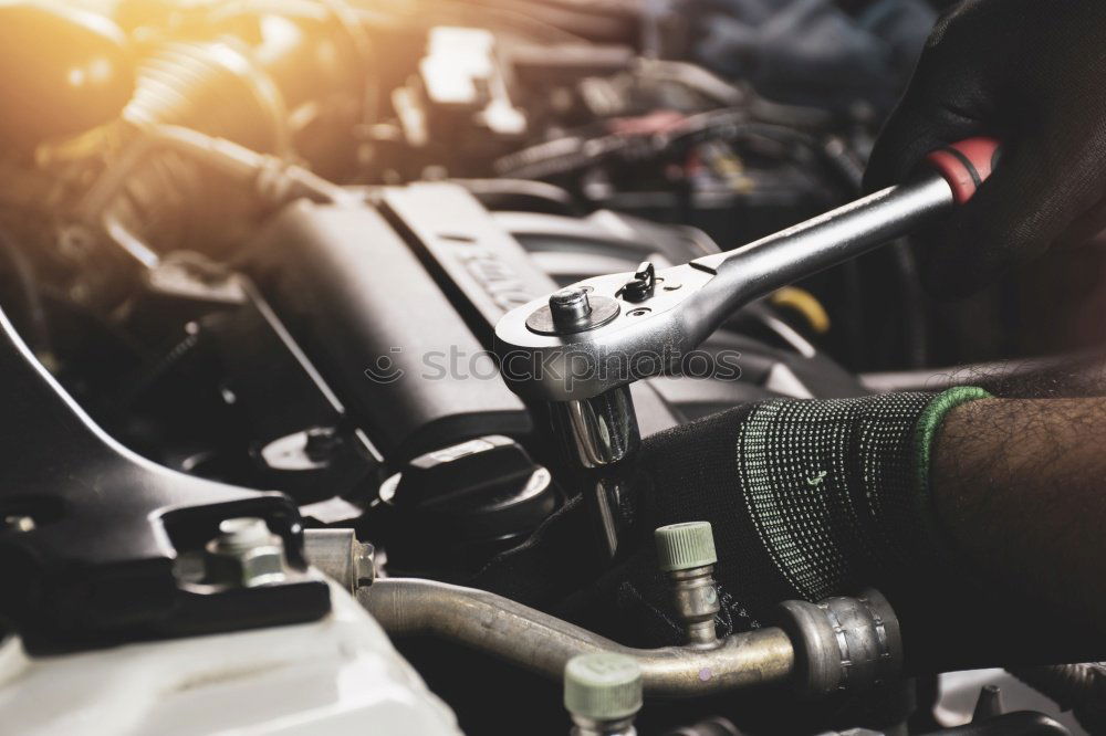 Professional Mechanic Repairing Car.