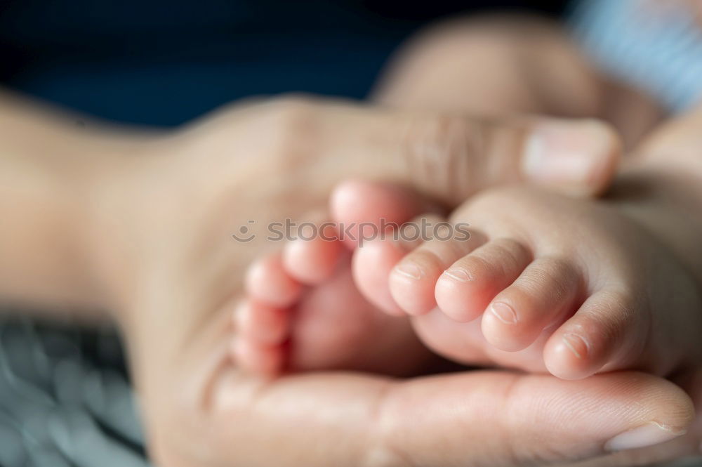 Similar – Image, Stock Photo Father holding newborn baby son at the day time. Concept of happy family.