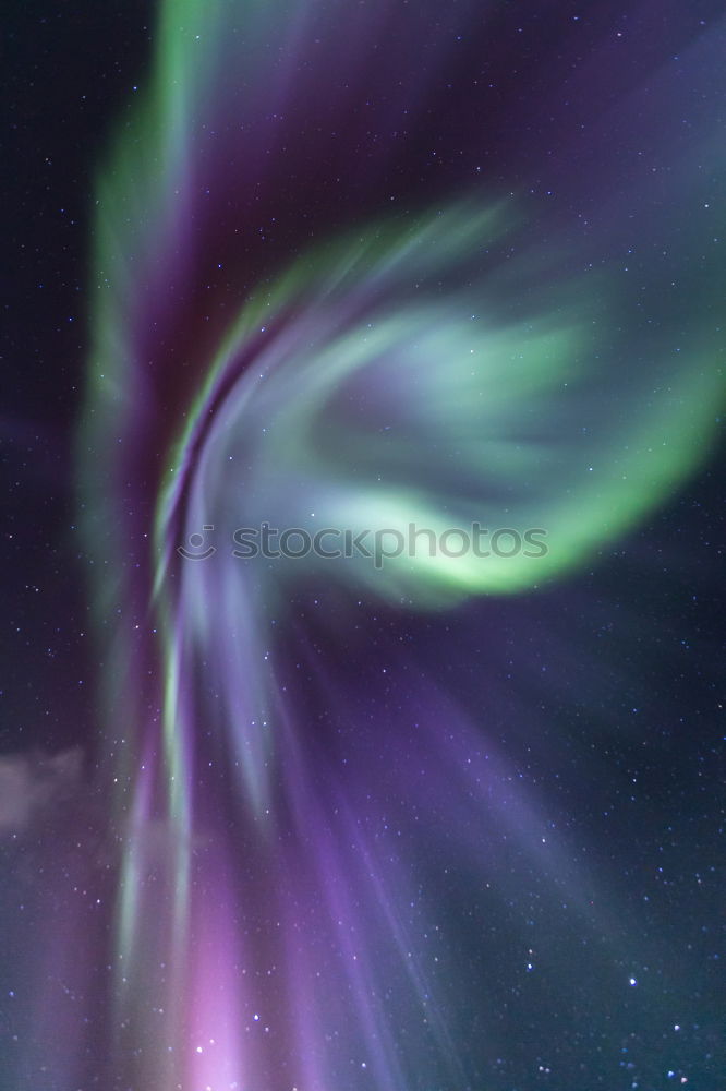 Similar – Northern lights before mountain silhouette